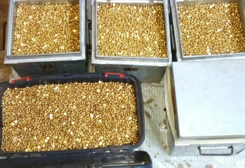 Fake gold nuggets in metal boxes