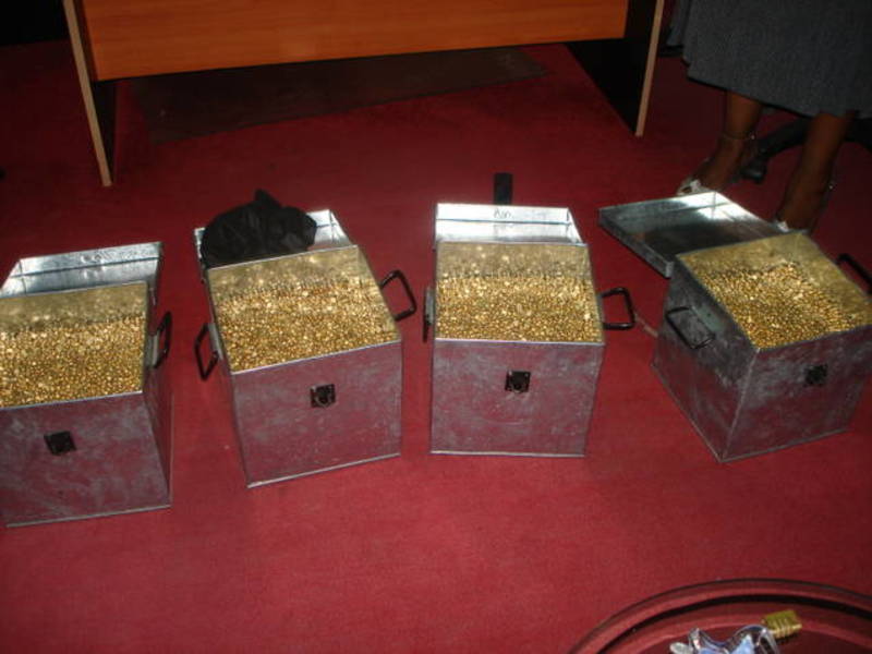 Fake gold nuggets in metal boxes