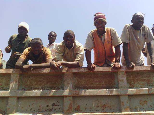 Miners on truck