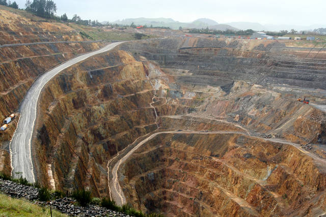 Mining's place in commerce, open pit mine on picture